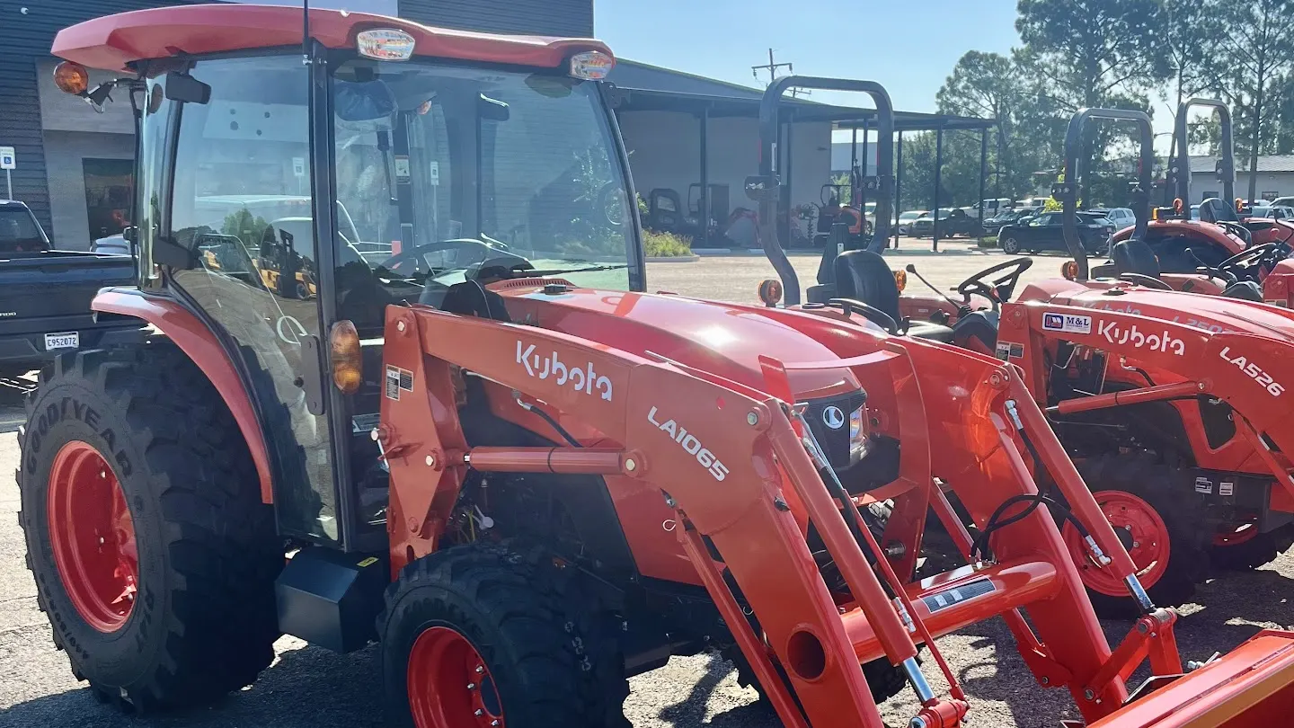 Kubota tractor with cab and LA1065 front loader on the M&L lot