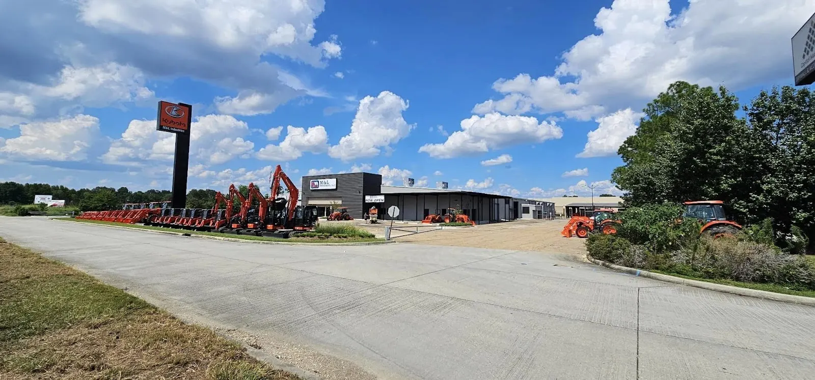 M&L Industries Baton Rouge store and equipment lot with Kubota excavators and tractors lined up